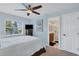 Light blue bedroom with a queen bed, TV, and access to a bathroom at 265 Belvedere Ct, Punta Gorda, FL 33950