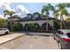 Exterior view of apartment building with parking lot and landscaping at 12904 Sanctuary Cove Dr # 301, Temple Terrace, FL 33637
