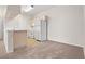 Open concept kitchen with white appliances and a breakfast bar at 12904 Sanctuary Cove Dr # 301, Temple Terrace, FL 33637