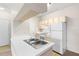 Efficient kitchen featuring white appliances and ample counter space at 12904 Sanctuary Cove Dr # 301, Temple Terrace, FL 33637
