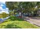 Parking area with lake views and landscaping at 12904 Sanctuary Cove Dr # 301, Temple Terrace, FL 33637