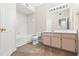 Clean bathroom with a vanity, toilet, and bathtub at 12904 Sanctuary Cove Dr # 301, Temple Terrace, FL 33637