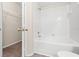 Updated bathroom with tub/shower combo and wood-look flooring at 12904 Sanctuary Cove Dr # 301, Temple Terrace, FL 33637