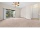 Bright living room with carpeted floors and sliding door to balcony at 12904 Sanctuary Cove Dr # 301, Temple Terrace, FL 33637