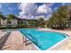 Inviting community swimming pool with a large deck at 12904 Sanctuary Cove Dr # 301, Temple Terrace, FL 33637