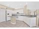 Bright kitchen with white cabinets, gray countertops, and tile flooring at 6225 Willet Ct, Lakewood Ranch, FL 34202