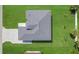 Aerial view of a single-Gathering home with a paved driveway and grassy lawn at 3323 Elkcam Blvd, Port Charlotte, FL 33952