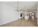 Bright dining room with chandelier and sliding glass doors to patio at 112 Runaway Field Ave, Nokomis, FL 34275