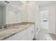Bathroom with double vanity and granite countertop at 168 Lazy Shore Dr, Nokomis, FL 34275