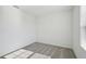 Simple bedroom with grey carpet and window with blinds at 168 Lazy Shore Dr, Nokomis, FL 34275