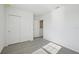 Bright bedroom with grey carpet, large closet, and window with blinds at 168 Lazy Shore Dr, Nokomis, FL 34275
