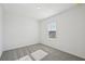 Simple bedroom with grey carpet and window at 168 Lazy Shore Dr, Nokomis, FL 34275