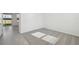 Bright bedroom with grey carpet and large window at 168 Lazy Shore Dr, Nokomis, FL 34275