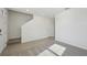 Entryway with staircase and grey carpeting at 168 Lazy Shore Dr, Nokomis, FL 34275