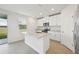 Modern kitchen with white cabinets and granite countertops at 168 Lazy Shore Dr, Nokomis, FL 34275