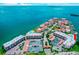 Aerial view of waterfront community, tennis courts, and parking at 106 1St E St # 311, St Petersburg, FL 33715