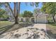 One-story house with a driveway and mature trees at 8402 Mill Creek Ln, Hudson, FL 34667