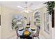 Bright breakfast nook with a glass-top table and four chairs at 7319 Eleanor Cir, Sarasota, FL 34243