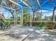 Spacious screened patio with pavers and lush landscaping at 7319 Eleanor Cir, Sarasota, FL 34243