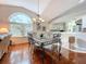 Spacious dining area with hardwood floors and kitchen views at 7319 Eleanor Cir, Sarasota, FL 34243