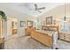 Large main bedroom with king-size bed and en-suite bathroom at 7319 Eleanor Cir, Sarasota, FL 34243