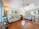 Comfortable living room featuring hardwood floors and two sofas at 7319 Eleanor Cir, Sarasota, FL 34243