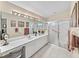 Double vanity bathroom with walk-in shower at 7319 Eleanor Cir, Sarasota, FL 34243