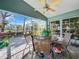 Covered patio with seating area and ceiling fan at 7319 Eleanor Cir, Sarasota, FL 34243