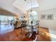 Bright dining room with glass-top table and hardwood floors at 7319 Eleanor Cir, Sarasota, FL 34243