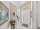 Bright entryway with a view into dining area, and decorative elements at 7319 Eleanor Cir, Sarasota, FL 34243