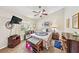 Bright bedroom with a comfortable bed and ceiling fan at 7319 Eleanor Cir, Sarasota, FL 34243