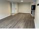 Spacious living room with wood-look floors and an open floor plan at 624 Golden Raintree Pl # 624, Brandon, FL 33510