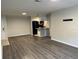Open concept living room and kitchen with wood-look floors at 624 Golden Raintree Pl # 624, Brandon, FL 33510