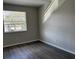 Spacious bedroom with large window and wood flooring at 624 Golden Raintree Pl # 624, Brandon, FL 33510