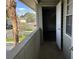 Private balcony with access from unit, overlooking parking lot and partial view of trees at 624 Golden Raintree Pl # 624, Brandon, FL 33510