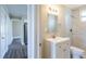 Clean bathroom with white vanity, tile shower, and mirror at 4701 13Th S Ave, St Petersburg, FL 33711