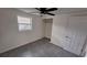 Bedroom featuring tile flooring, neutral paint, natural light, and a closet at 4652 Alma St, New Port Richey, FL 34652