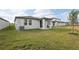 Spacious backyard with covered patio and grassy lawn at 113 Whiteland Bnd, Nokomis, FL 34275