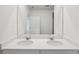Double vanity bathroom with modern fixtures and a large mirror at 113 Whiteland Bnd, Nokomis, FL 34275