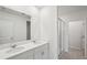 Clean bathroom, featuring double sinks and a shower at 113 Whiteland Bnd, Nokomis, FL 34275