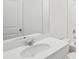 Clean bathroom with white vanity, sink, and large mirror at 113 Whiteland Bnd, Nokomis, FL 34275