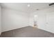 Bright bedroom with grey carpet and ensuite bathroom at 113 Whiteland Bnd, Nokomis, FL 34275