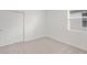 Well-lit bedroom with double door closet and carpet at 113 Whiteland Bnd, Nokomis, FL 34275
