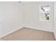 Well-lit bedroom with carpeted floor and window with blinds at 113 Whiteland Bnd, Nokomis, FL 34275