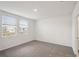 Spacious bedroom with grey carpet and two windows at 113 Whiteland Bnd, Nokomis, FL 34275