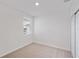 Spacious bedroom featuring carpeted floors and a window with blinds at 113 Whiteland Bnd, Nokomis, FL 34275