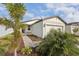 House exterior with walkway, landscaping, and paver driveway at 113 Whiteland Bnd, Nokomis, FL 34275