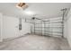 Attached garage with overhead door and concrete floor at 113 Whiteland Bnd, Nokomis, FL 34275