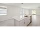 Open kitchen with island and stainless steel appliances at 113 Whiteland Bnd, Nokomis, FL 34275