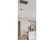 White kitchen features an island, stainless steel appliances, and white cabinets at 113 Whiteland Bnd, Nokomis, FL 34275